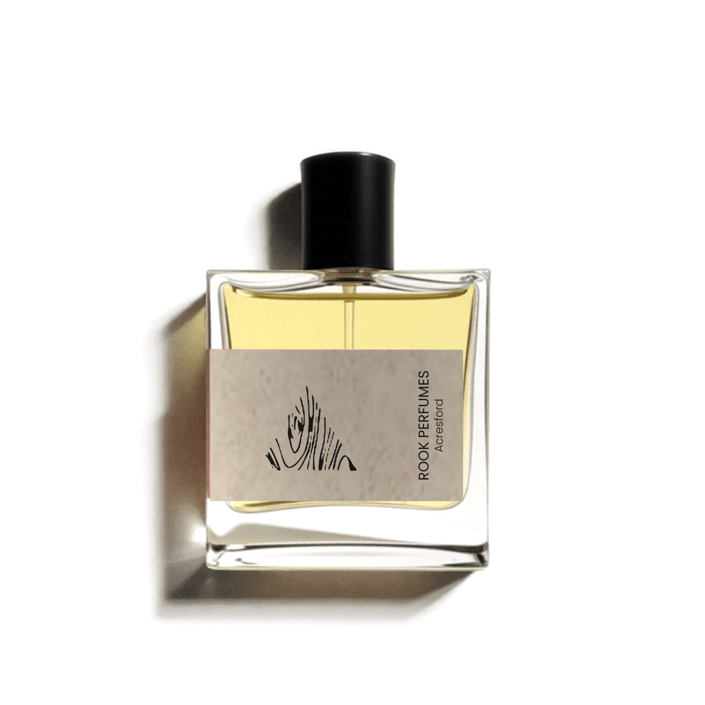 Rook Acresford Eau De Parfum bottle featuring smoky rose and cedar scent, with elegant glass design and fragrance details.