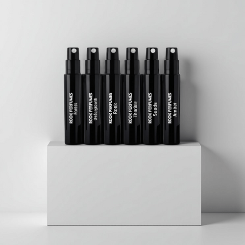 Rook Perfumes Discovery Set Sampler featuring various fragrance vials and a 15% voucher in a stylish display.